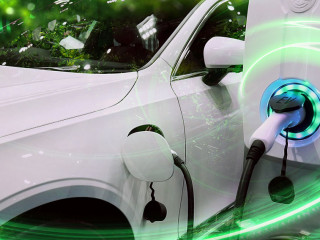 EV Car or Electric vehicle at charging station with the power cable supply plugged in on blurred nature with green energy power effect. Eco-friendly sustainable energy concept.