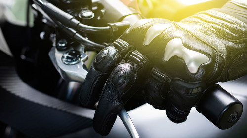 Close up of hand and clutch lever motorcycle, Hands wearing blac