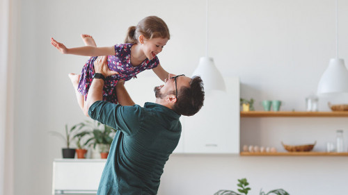 Father's day. Happy family daughter hugs his dad