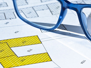Imaginary cadastral map with buildings, land parcel and vacant plot - land and property registry and real estate property concept illustration
