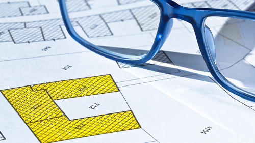 Imaginary cadastral map with buildings, land parcel and vacant plot - land and property registry and real estate property concept illustration