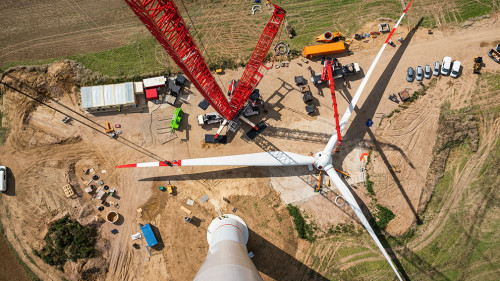 Assembled rotor blades of a wind turbine are seen from high abov