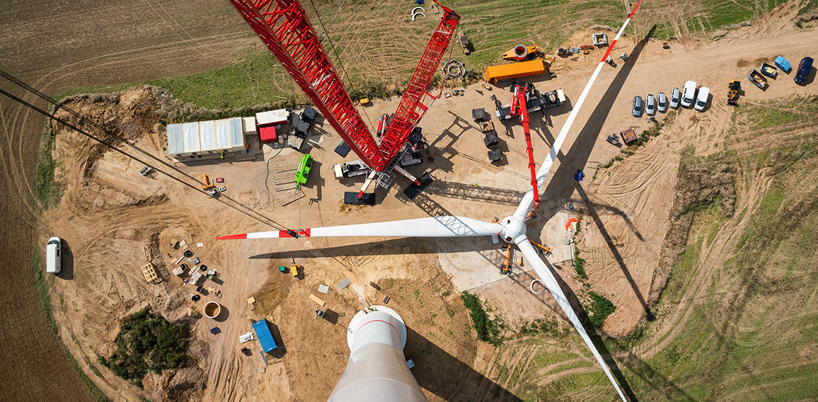 Assembled rotor blades of a wind turbine are seen from high abov