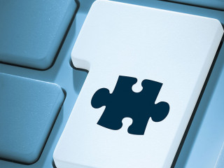 Composite image of jigsaw piece on enter key