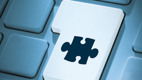 Composite image of jigsaw piece on enter key