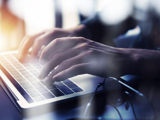 Business man works in office with laptop. Concept of internet network. double exposure