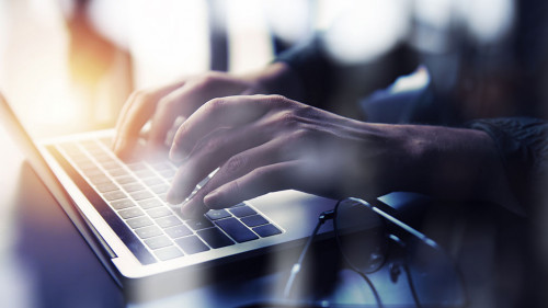 Business man works in office with laptop. Concept of internet network. double exposure