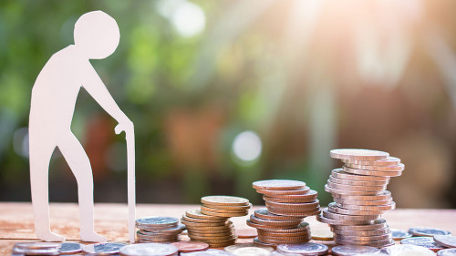 old man model set step on money coins saving for concept investm