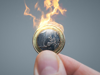 Euro coin on fire