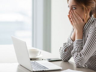 Businesswoman rounding eyes shocked with company market crash