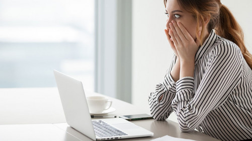 Businesswoman rounding eyes shocked with company market crash
