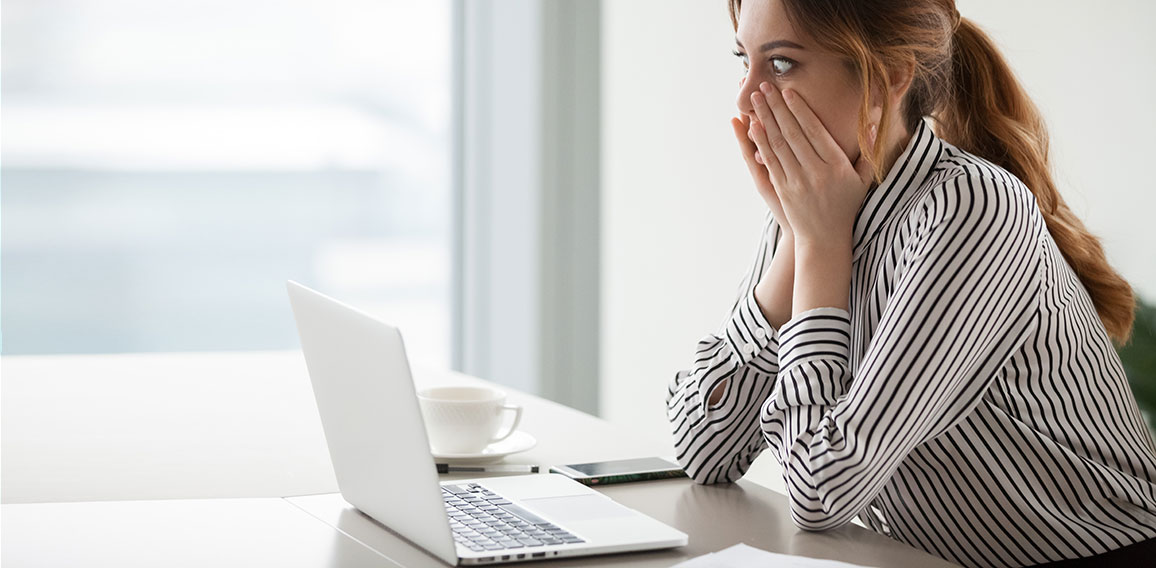 Businesswoman rounding eyes shocked with company market crash