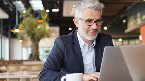 Smiling businessman in informal meeting
