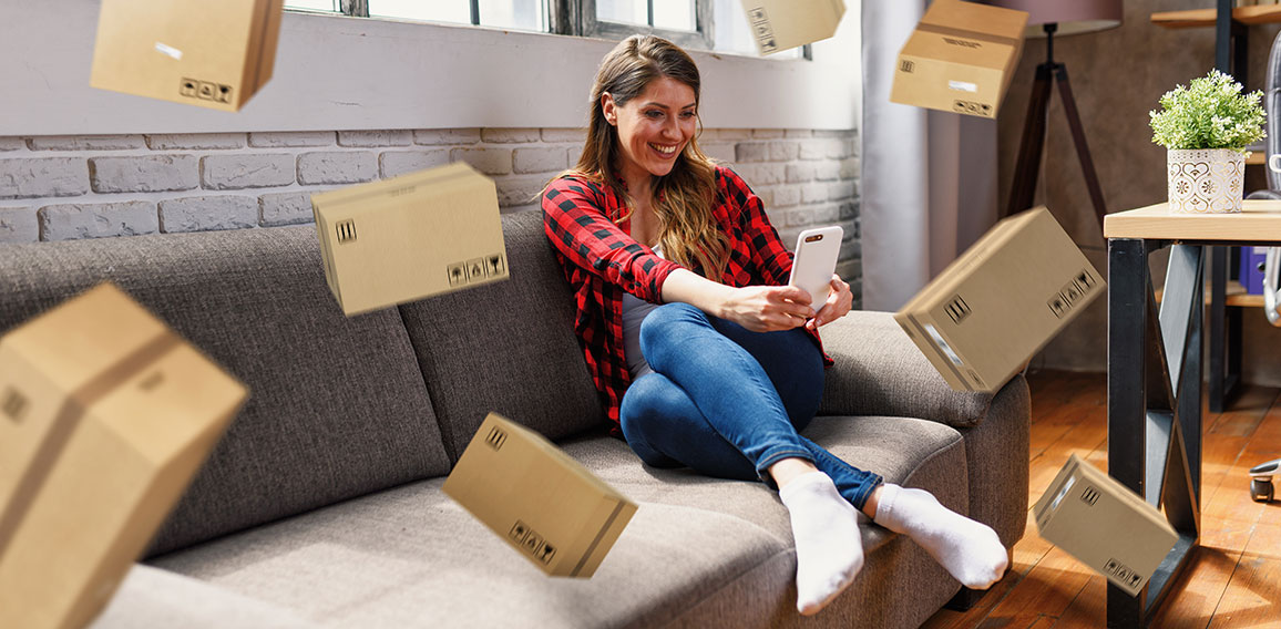 Woman does shopping through e-commerce online shop. Concept of fast delivery