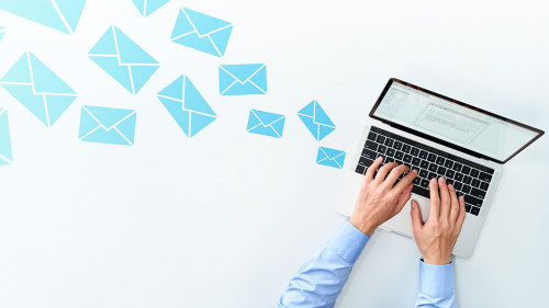 Business man sending and receiving email on white table. Using l