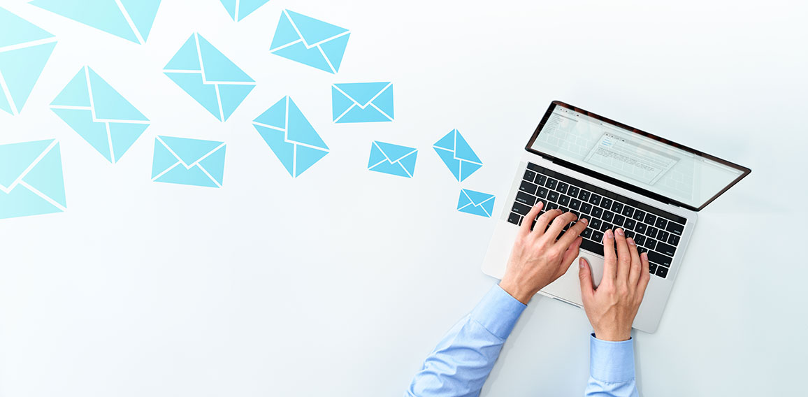 Business man sending and receiving email on white table. Using l