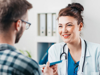 Woman Doctor prescribes medicine to Young Patient