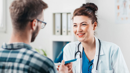 Woman Doctor prescribes medicine to Young Patient