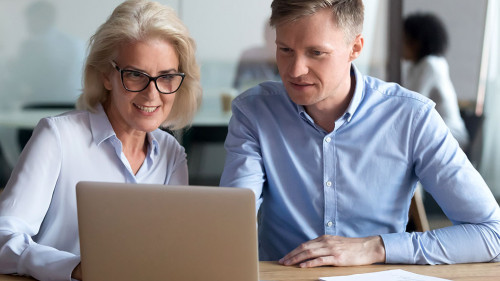 Middle aged manager make business offer to client on laptop