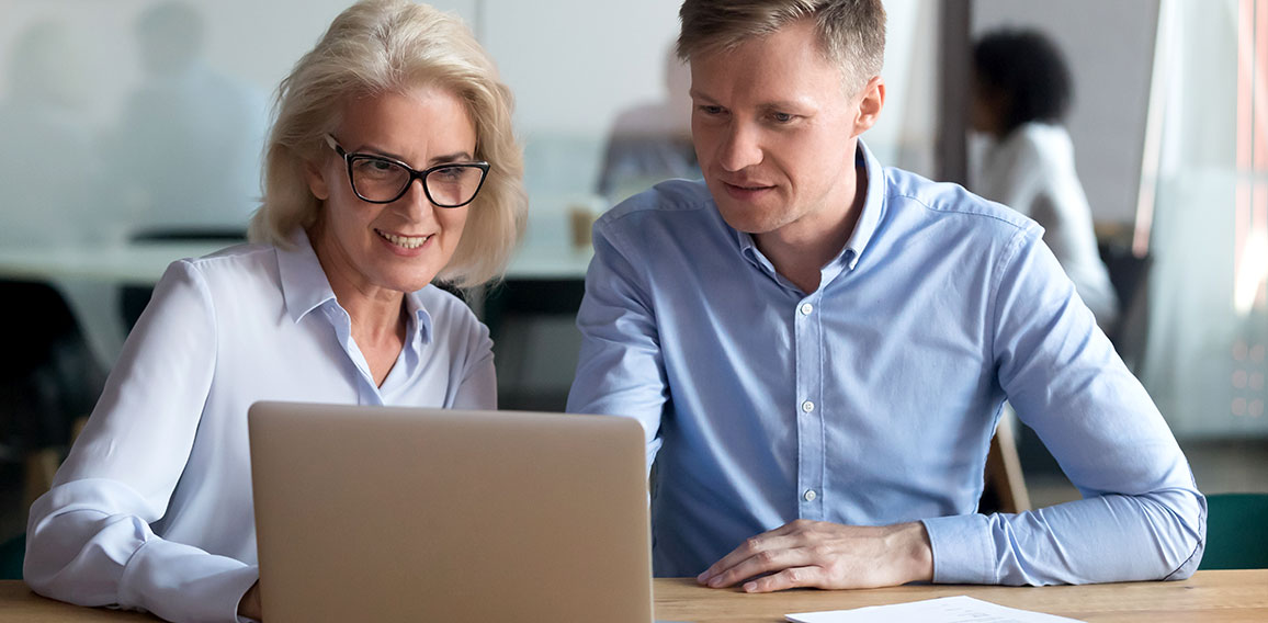 Middle aged manager make business offer to client on laptop