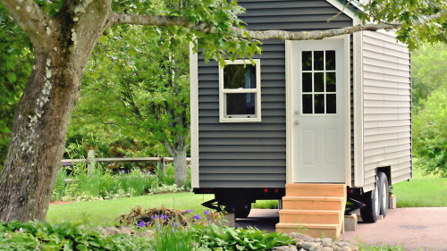 Tiny gray house on wheels
