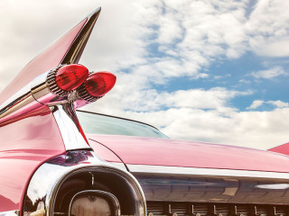 Rear end of a pink classic car