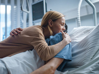 In the Hospital, Happy Wife Visits Her Recovering Husband who is
