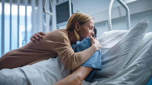 In the Hospital, Happy Wife Visits Her Recovering Husband who is