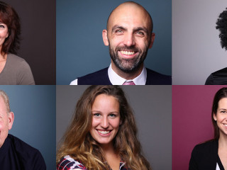 Group of 9 beautiful people in front of a background