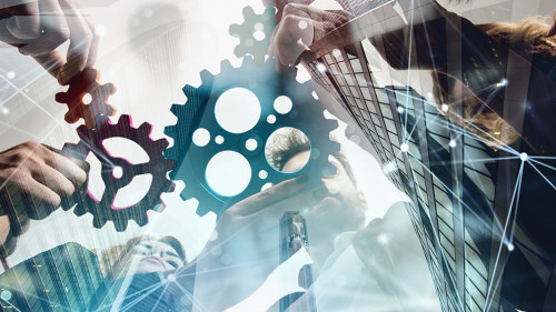 Business team connect pieces of gears. Teamwork, partnership and integration concept. double exposure with network effects