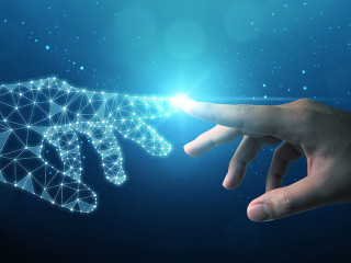 Hand of businessman touching hand artificial intelligence meaning technology connection go to future