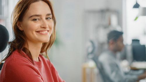 Portrait of Beautiful Young Woman with Red Hair Wearing Yellow S