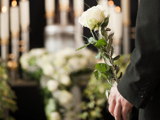 Religion, death and dolor - man at funeral