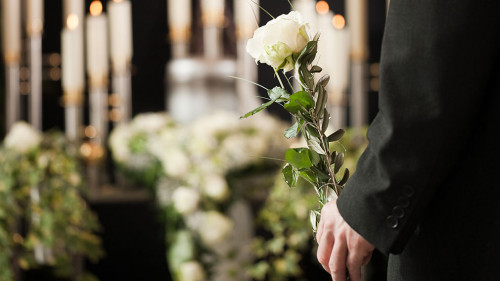 Religion, death and dolor - man at funeral