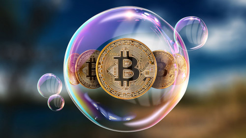 Gold Coins Bitcoin in a soap bubble. The concept of instability of the crypto currency, electronic money, the burning of the crypto currency.