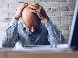 Nervous upset man with financial problems. Depressed man and financial crisis.