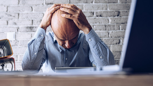 Nervous upset man with financial problems. Depressed man and financial crisis.