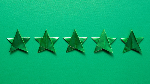 Five stars quality rating on blue background