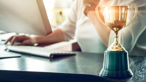 Business people working reward with golden trophy cup award to w