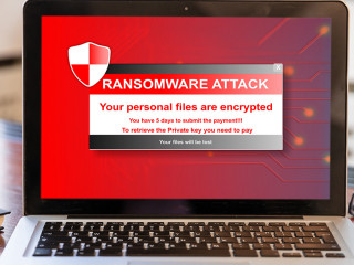 Ransomware attack concept. Ransomware text on a laptop screen