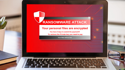 Ransomware attack concept. Ransomware text on a laptop screen