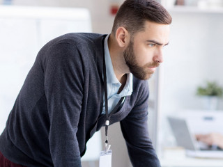 Nervous Businessman using Computer