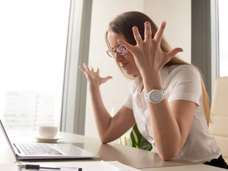 Angry businesswoman having problem with computer, broken laptop,