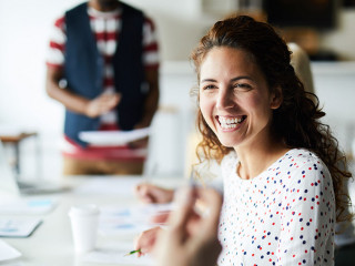 Happy businesswoman at meeting