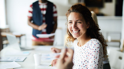 Happy businesswoman at meeting