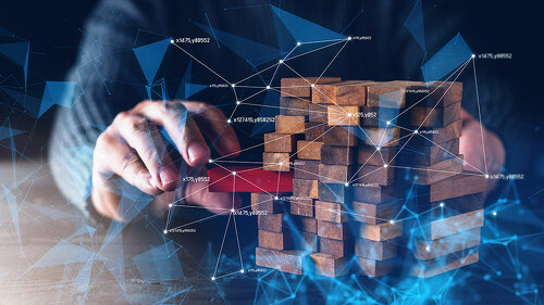 business man hand built structure wood block with virtual line c