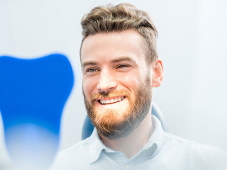 Man with great smile at the dental office