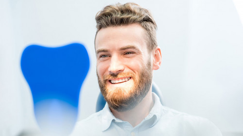 Man with great smile at the dental office