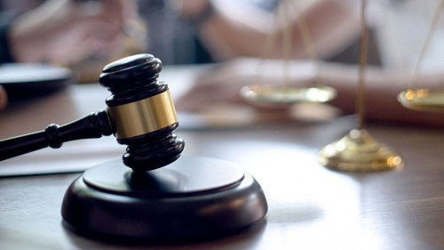 Lawyer or judge gavel with balance handshake