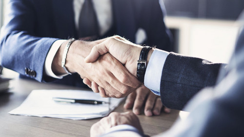 Business partnership meeting in office